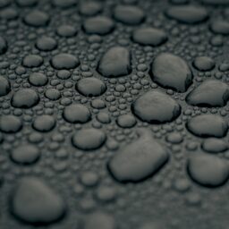 water droplets on gray surface